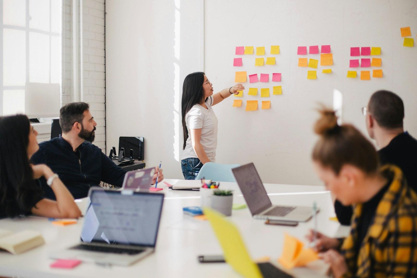 A product and engineering team mapping out a build sprint on a whiteboard